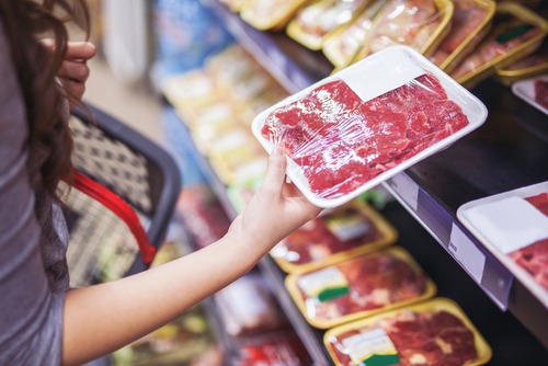Close,Up,Of,Woman,Holding,Wrapped,Meat,In,Grocery,Store